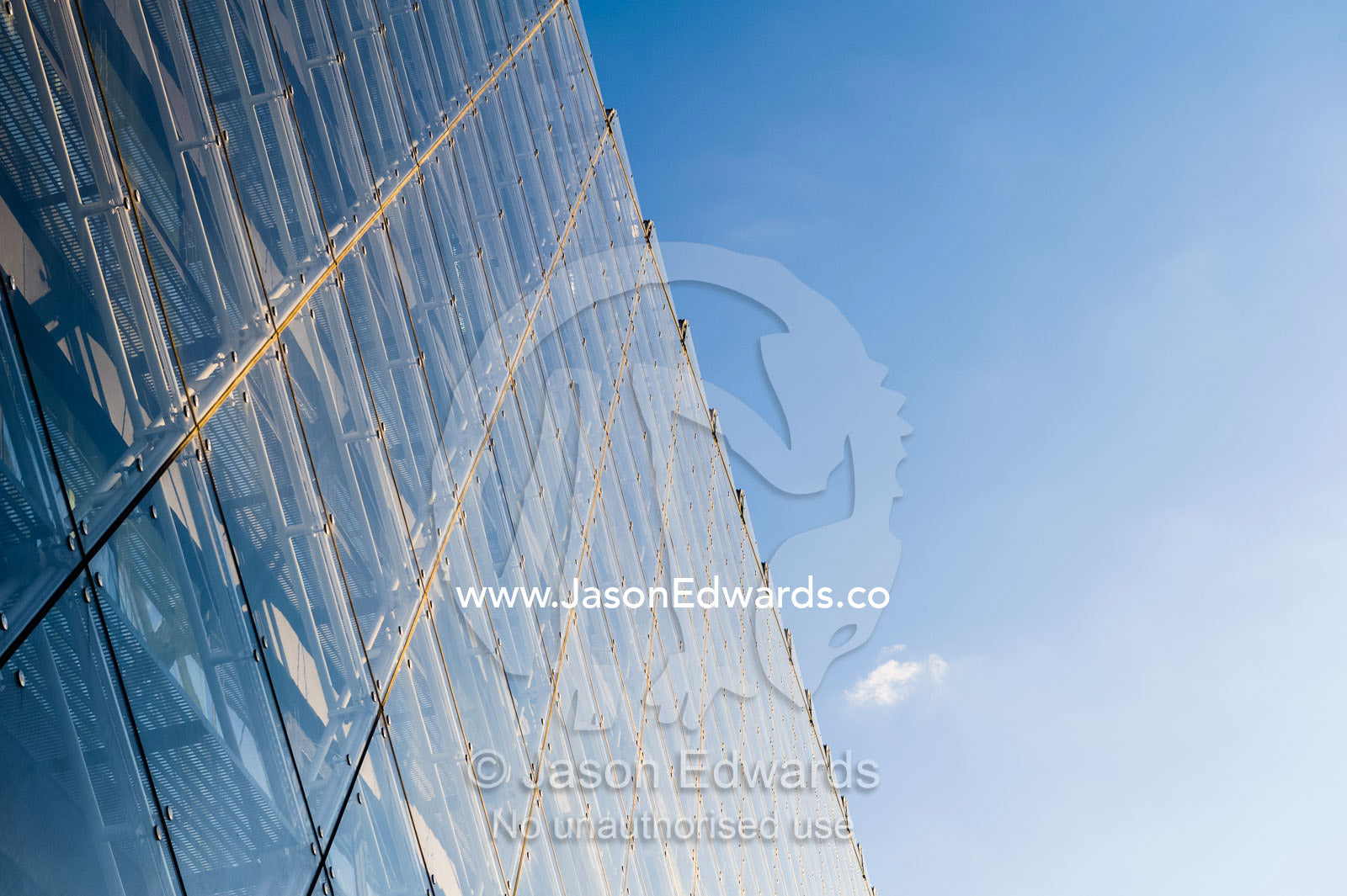 The glass and steel facade of a shopping complex in Copenhagen. Copenhagen, Denmark.