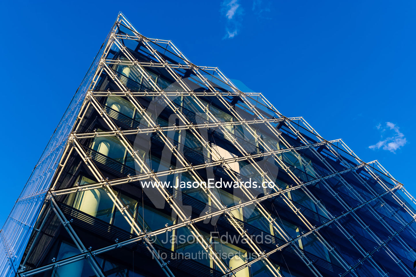 The glass and steel facade of a shopping complex in Copenhagen. Copenhagen, Denmark.