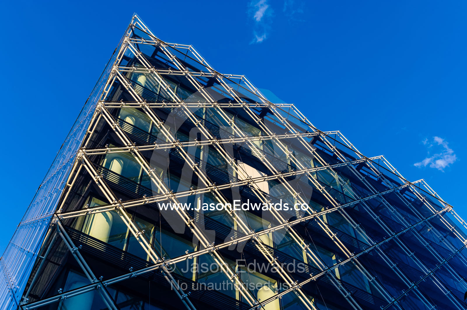 The glass and steel facade of a shopping complex in Copenhagen. Copenhagen, Denmark.