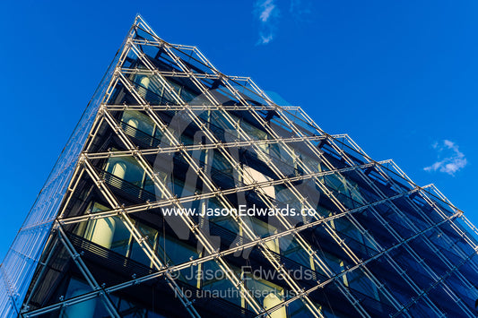 The glass and steel facade of a shopping complex in Copenhagen. Copenhagen, Denmark.