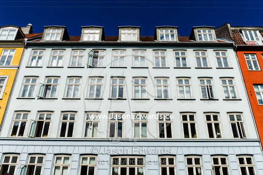 The colourful facades and windows of houses and apartments in Copenhagen. Copenhagen, Denmark.