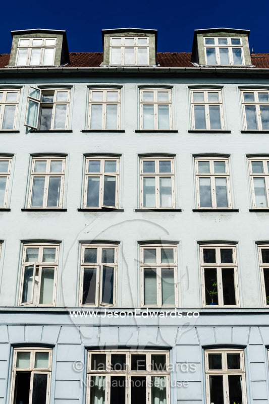The colourful facades and windows of houses and apartments in Copenhagen. Copenhagen, Denmark.