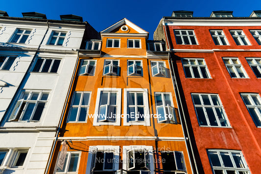 Colorful buildings and restaurants along a canal in summer. Nyhavn Canal, Copenhagen, Hovedstaden Region, Denmark.