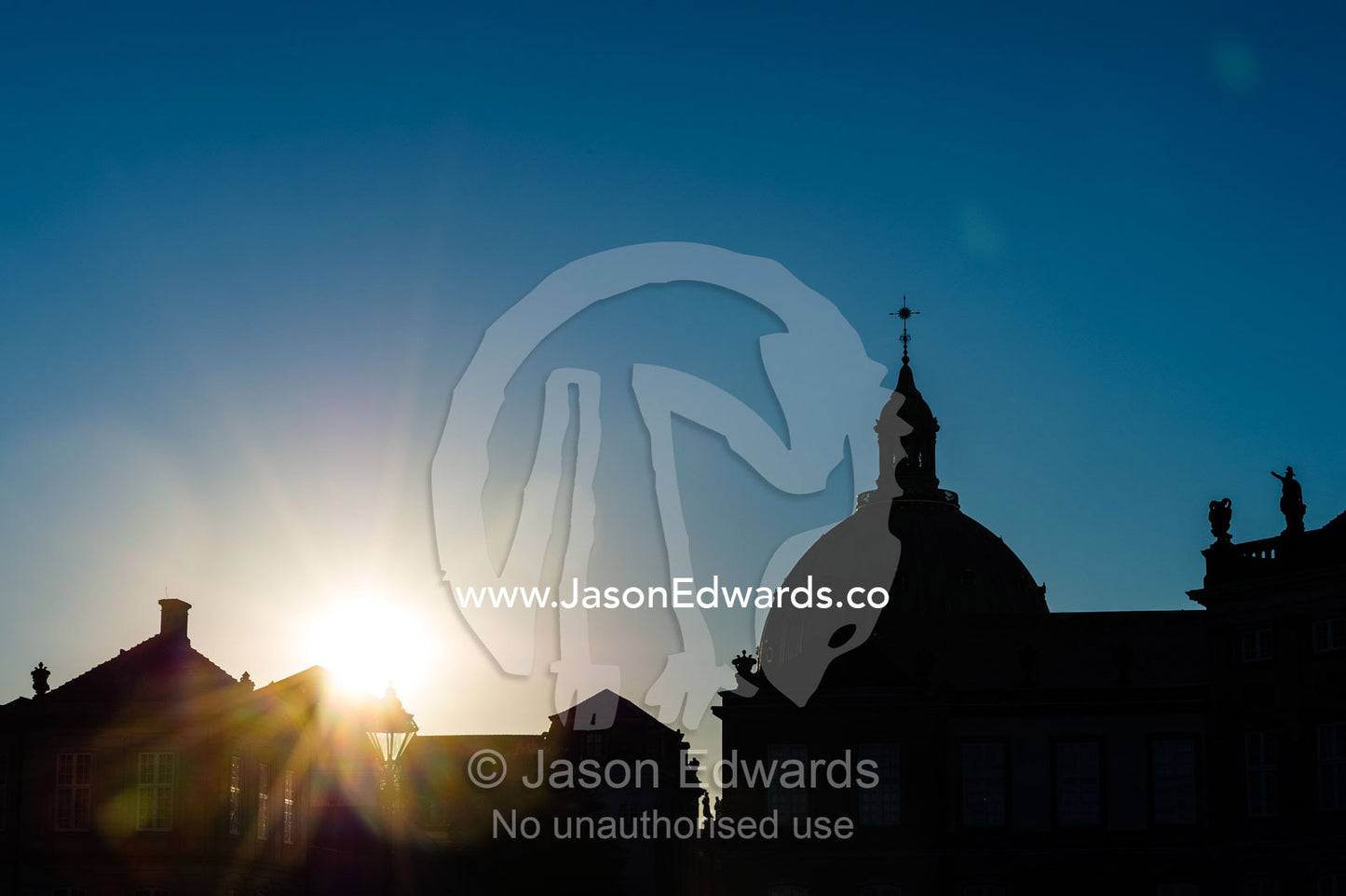 The silhouette of a church dome at sunset. Dome of the  Marble Church, Frederiks Church, Amalienborg Palace, Copenhagen, Denmark.