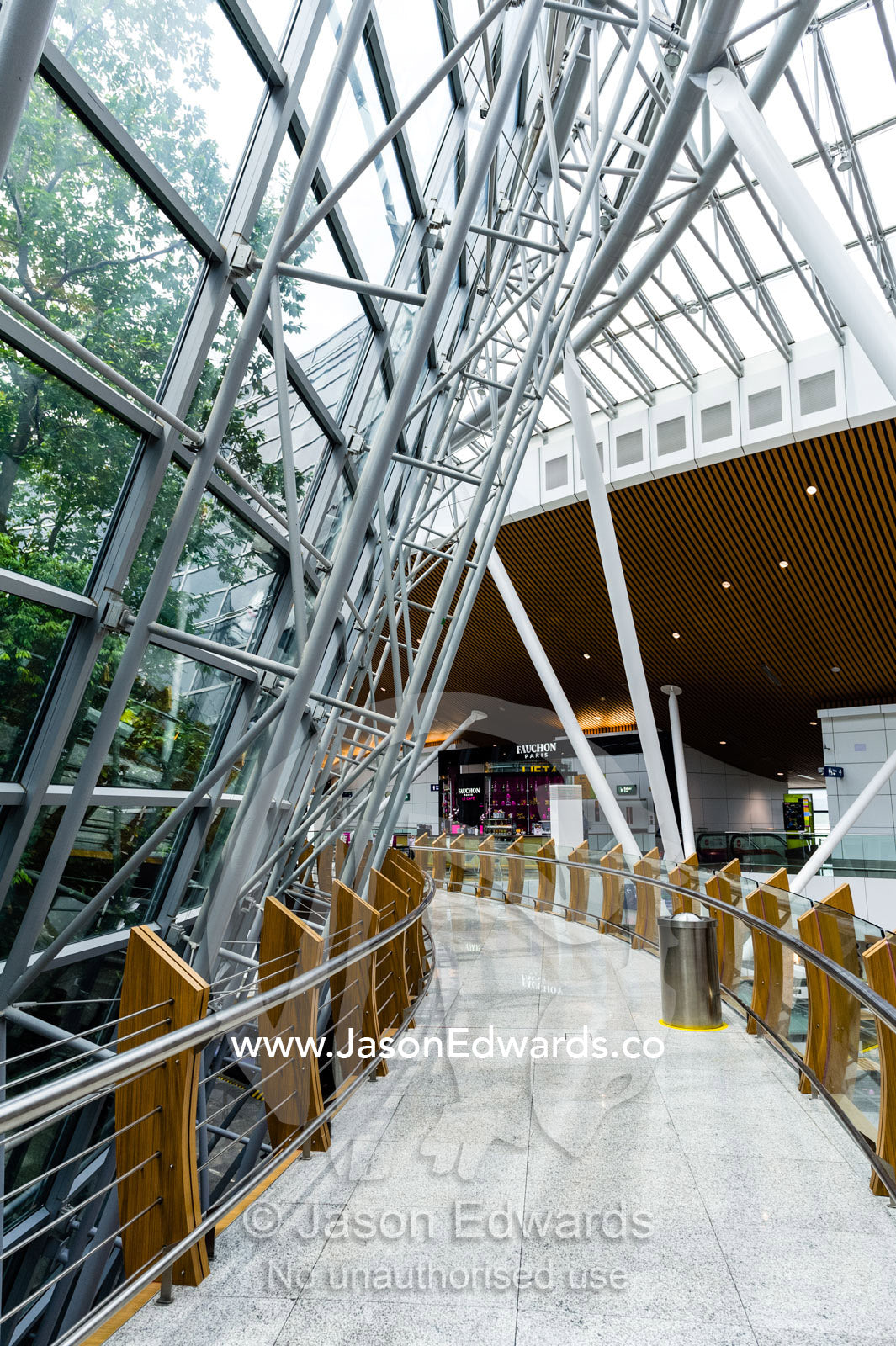 The steel and glass facade of the rainforest botanical garden at Kuala Lumpur International airport. Kuala Lumpur International Airport, Malaysia,