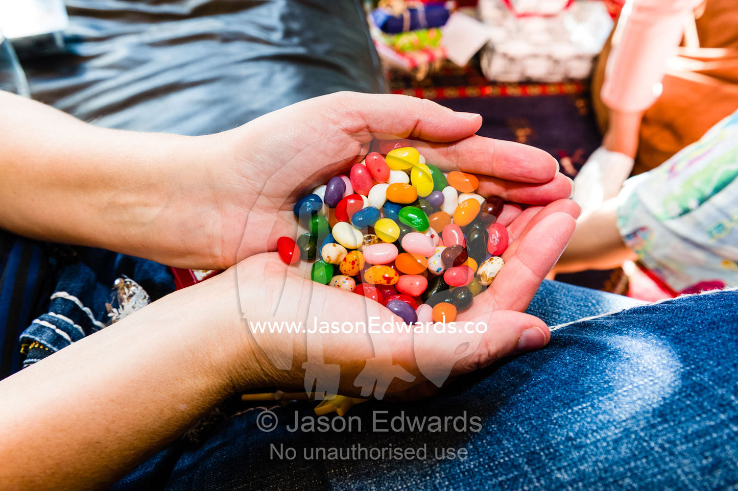 A handful of colourful jelly beans on Christmas day. East Malvern, Melbourne, Victoria, Australia.
