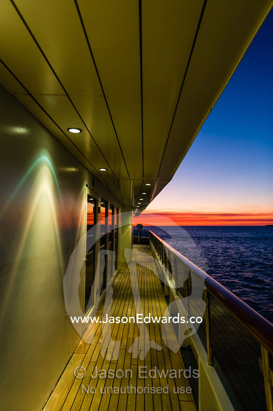 Scallop spotlights on the deck of a cruise ship at sunset. Broome, Kimberley Coast, Western Australia, Australia.