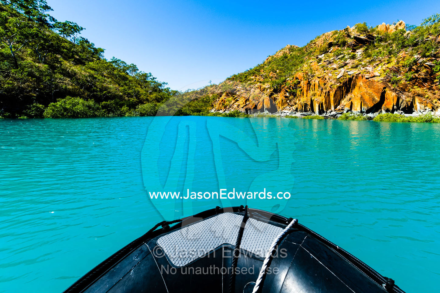 The bow of an inflatable zodiac dingy in a turquoise bay. Horizontal Falls, McLarty Range, Talbot Bay, Buccaneer Archipelago, Kimberley Coast, Western Australia, Australia.