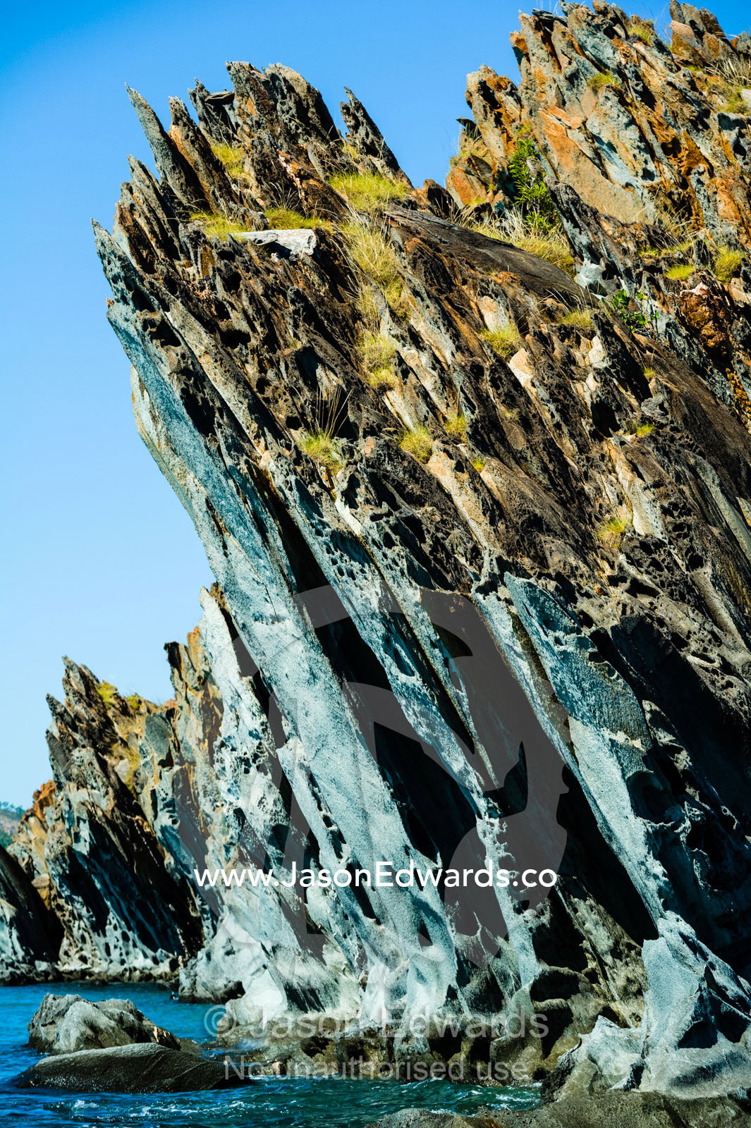 A jagged elgee sandstone formation along a coastline. near Cockatoo Island, Yampi Sound, Buccaneer Archipelago, Kimberley Coast, Western Australia, Australia.