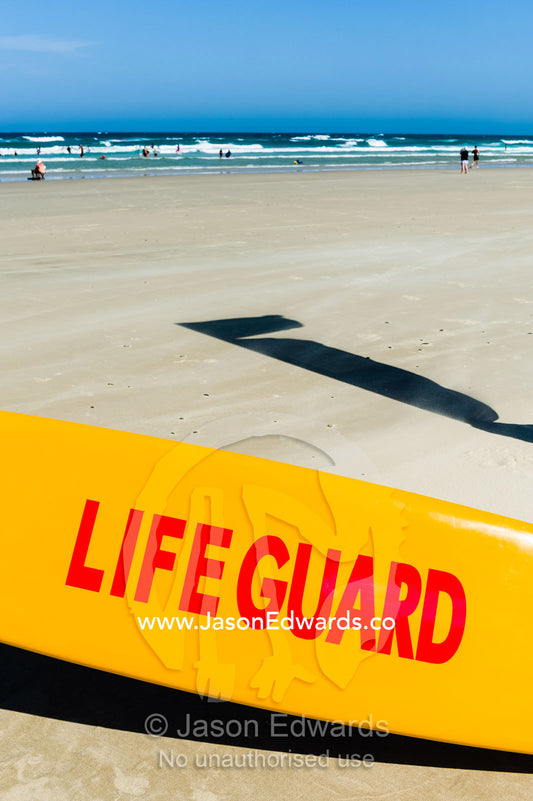 A surf lifesaving rescue board used by lifeguards. Byron Bay, New South Wales, Australia.