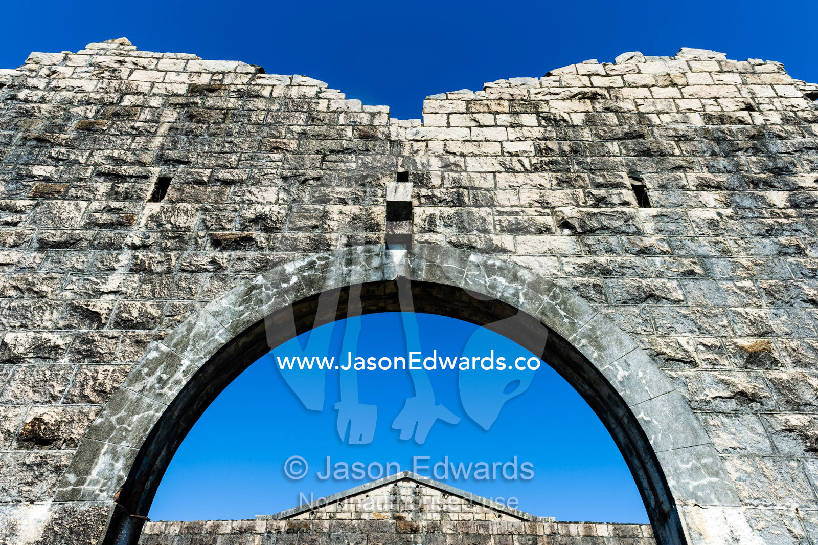 A limestone archway in an abbey in an antique prison. Trial Bay Goal, Laggers Point, Arakoon National Park, New South Wales, Australia.