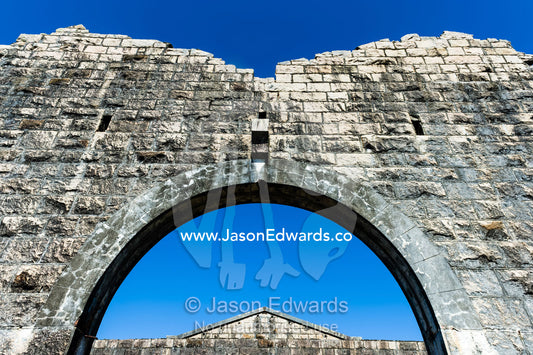A limestone archway in an abbey in an antique prison. Trial Bay Goal, Laggers Point, Arakoon National Park, New South Wales, Australia.