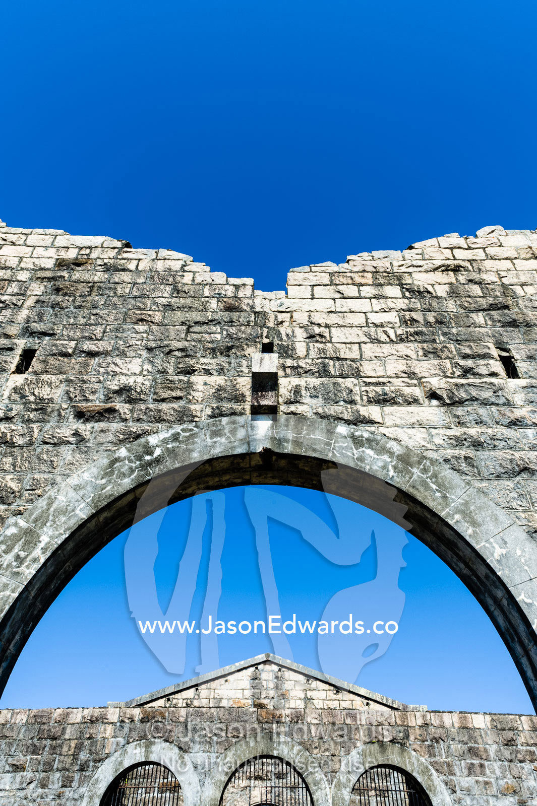 A limestone archway in an abbey in an antique prison. Trial Bay Goal, Laggers Point, Arakoon National Park, New South Wales, Australia.