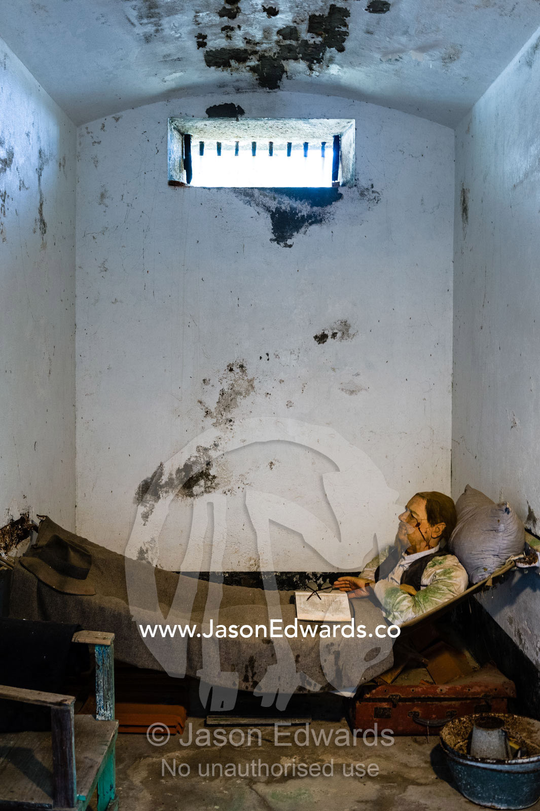 A diorama features a mannequin prisoner in a cell in an antique prison. Trial Bay Goal, Laggers Point, Arakoon National Park, New South Wales, Australia.