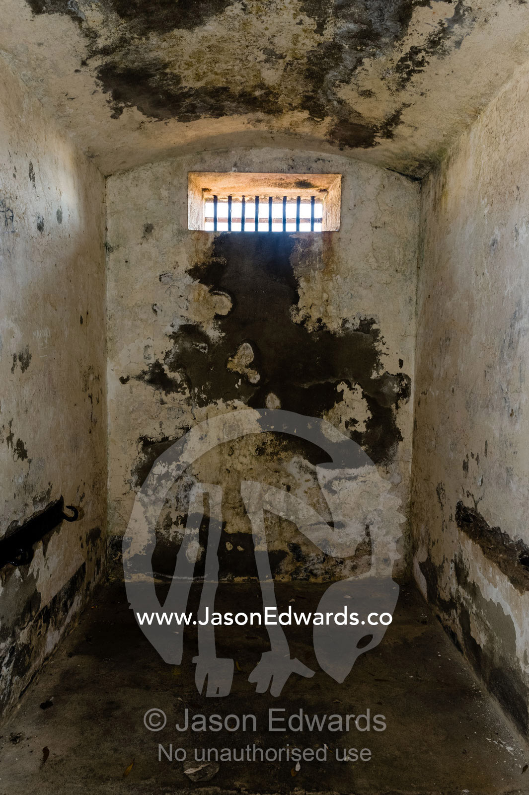 A dark and cold prisoners cell in an antique prison. Trial Bay Goal, Laggers Point, Arakoon National Park, New South Wales, Australia.
