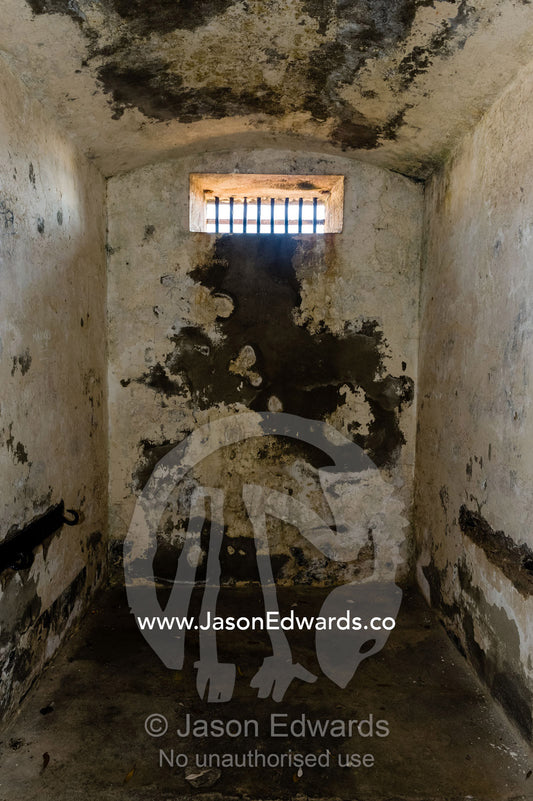 A dark and cold prisoners cell in an antique prison. Trial Bay Goal, Laggers Point, Arakoon National Park, New South Wales, Australia.