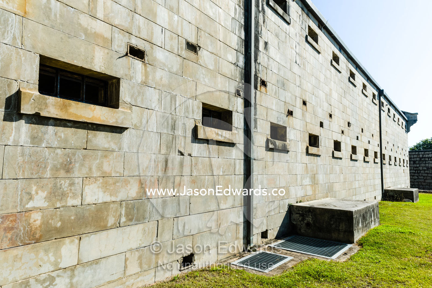 Small windows let in little light to prisoner cells in an antique prison. Trial Bay Goal, Laggers Point, Arakoon National Park, New South Wales, Australia.