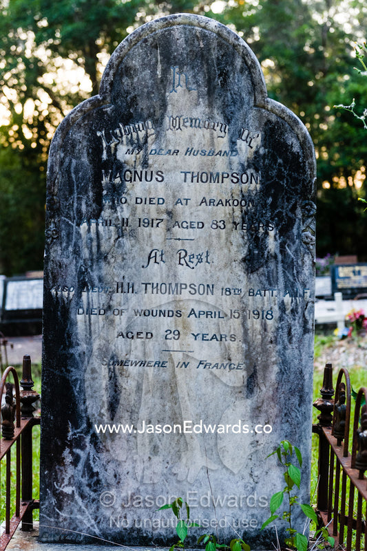 Graves and headstones in a forest cemetery in a rural town. Arakoon Cemetery, Arakoon, New South Wales, Australia.