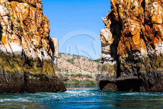 A fast moving tidal flow through a narrow gorge beneath the high tide mark. Horizontal Falls, McLarty Range, Talbot Bay, Kimberley Coast, Western Australia, Australia.
