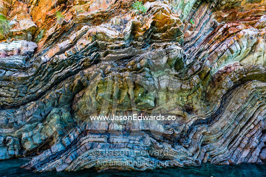 Sedimentary folding, you can actually tell what the stone was made of by looking closely, the different layers make for what almost makes a painting. this was not caused by extreme heat, but rather time and pressure. Cyclone Bay, Buccaneer Archipelago, Kimberley Coast, Western Australia, Australia.