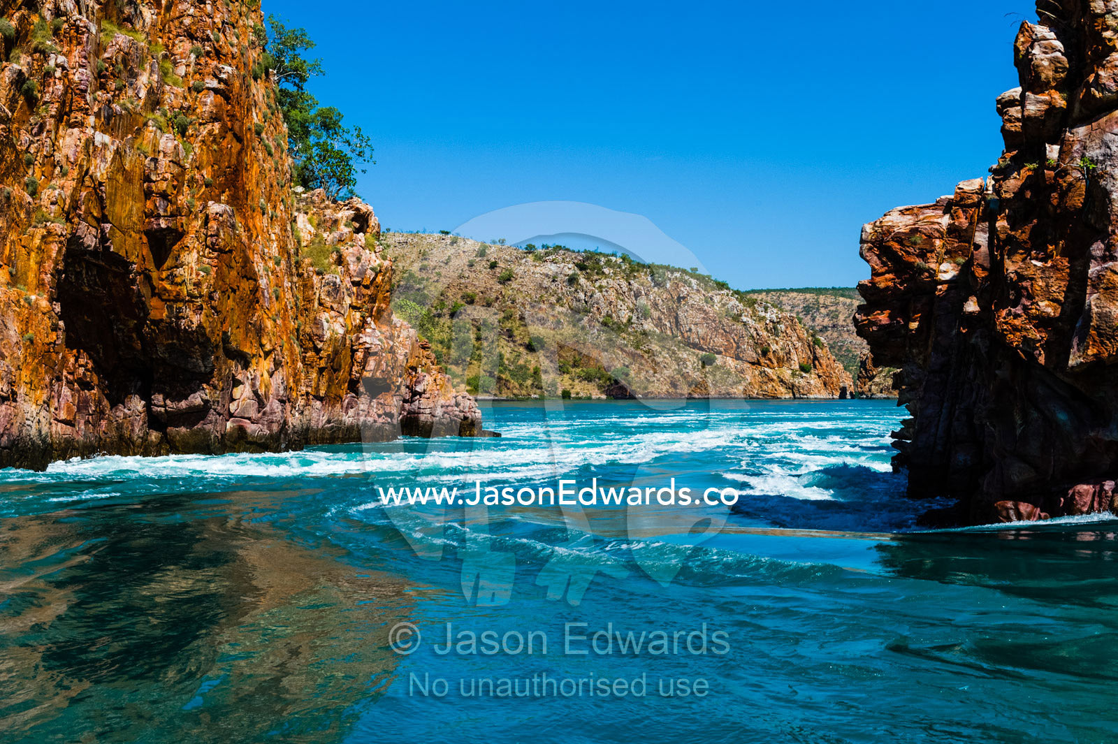 A fast moving tidal flow through a narrow gorge beneath the high tide mark. Horizontal Falls, McLarty Range, Talbot Bay, Buccaneer Archipelago, Kimberley Coast, Western Australia, Australia.