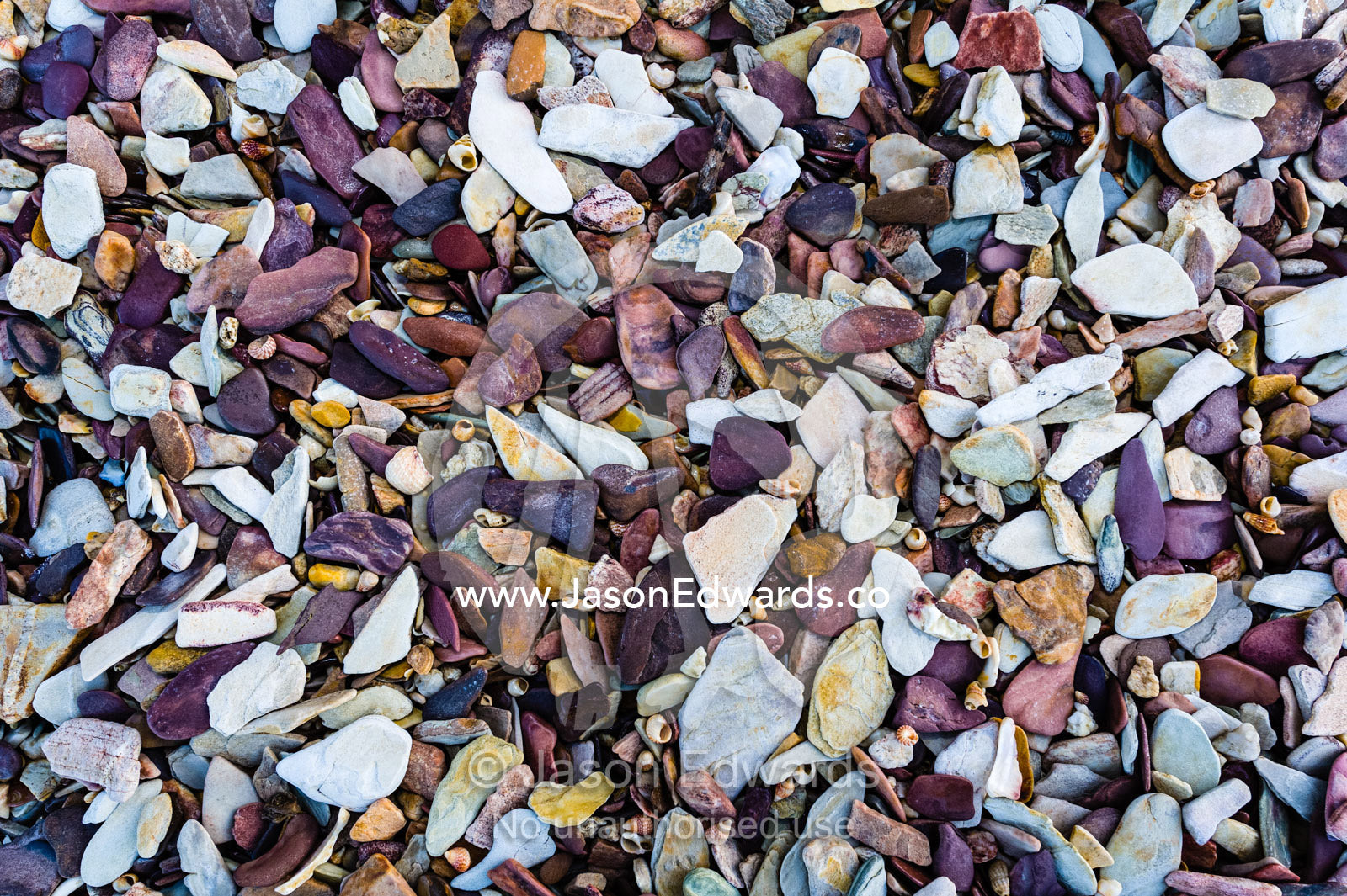 The colourful texture of pieces of shales on a Kimberley beach. Slug Island, Buccaneer Archipelago, Kimberley Coast, Western Australia, Australia.