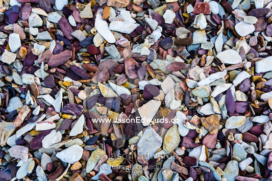 The colourful texture of pieces of shales on a Kimberley beach. Slug Island, Buccaneer Archipelago, Kimberley Coast, Western Australia, Australia.