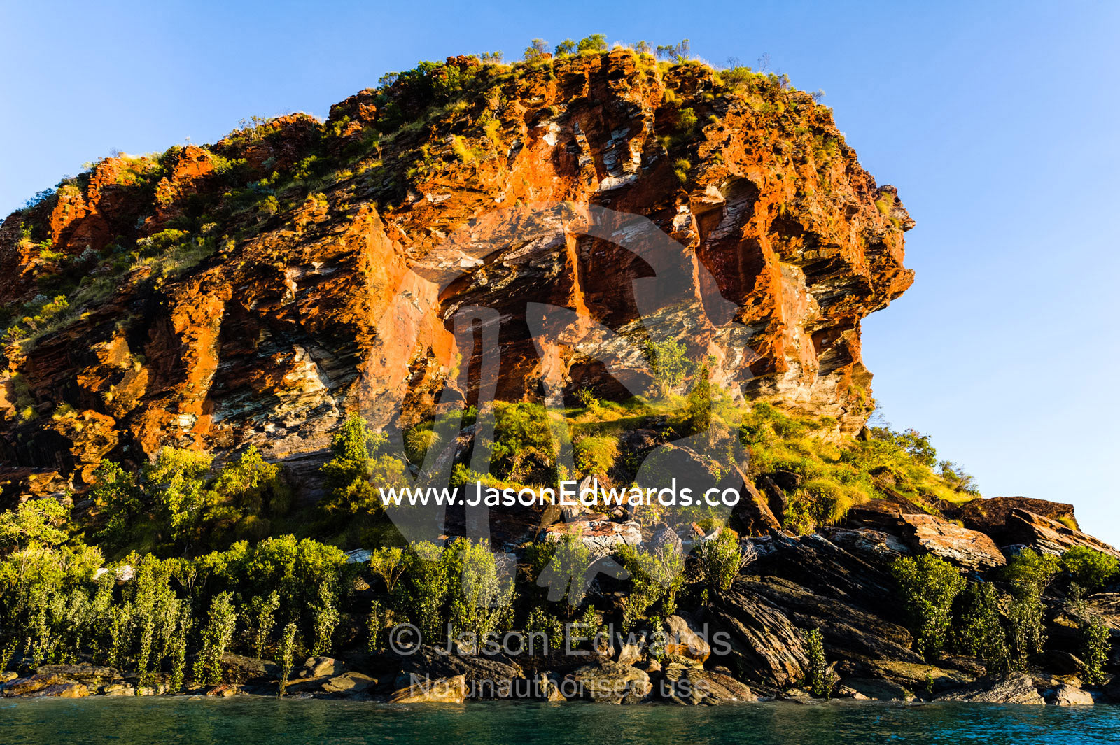 A jagged sandstone headland abuts the Kimberley coastline. Slug Island, Buccaneer Archipelago, Kimberley Coast, Western Australia, Australia.