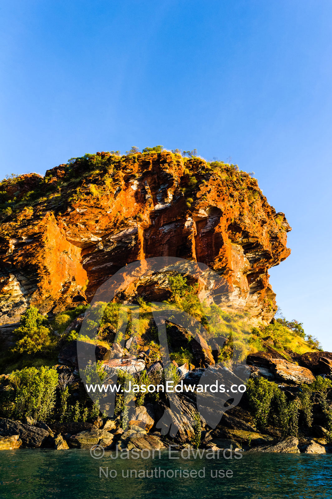 A jagged sandstone headland abuts the Kimberley coastline. Slug Island, Buccaneer Archipelago, Kimberley Coast, Western Australia, Australia.
