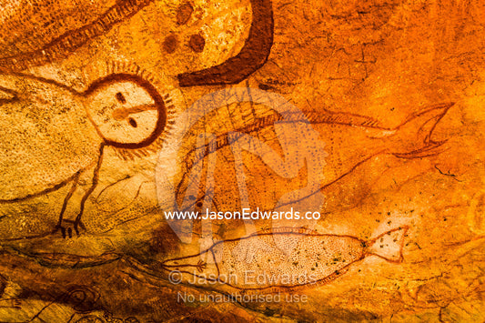 The rich ochre colours of an Aboriginal rock painting gallery featuring The Great Fish Chase. Raft Point, Doubtful Bay, Buccaneer Archipelago, Kimberley Coast, Western Australia, Australia.