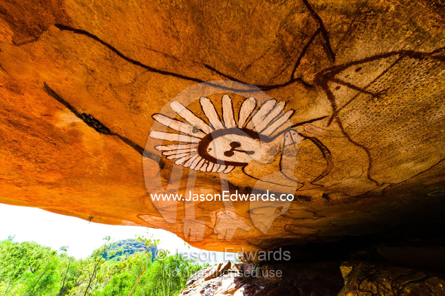 The rich ochre colours of an Aboriginal rock painting gallery featuring The Great Fish Chase. Raft Point, Doubtful Bay, Buccaneer Archipelago, Kimberley Coast, Western Australia, Australia.
