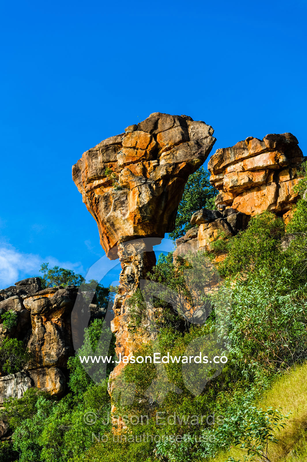 A giant anvil of sandstone precariously balanced on a pillar of rock. Prince Frederick Harbour, Kimberley Coast, Western Australia, Australia.