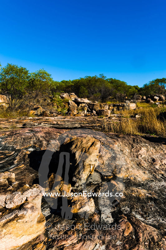Boulders on the rocky foreshore of remote desert island. Jar Island, Vansittart Bay, Kimberley Coast, Western Australia, Australia.