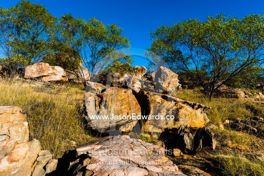 Boulders on the rocky foreshore of remote desert island. Jar Island, Vansittart Bay, Kimberley Coast, Western Australia, Australia.