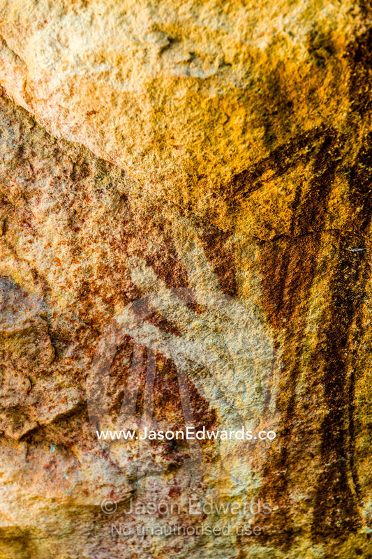Ancient Aboriginal Gwion Gwion rock paintings also know as Bradshaw rock art featuring hand stencils estimated at 50,000 years old on a cave wall. Jar Island, Vansittart Bay, Kimberley Coast, Western Australia, Australia.