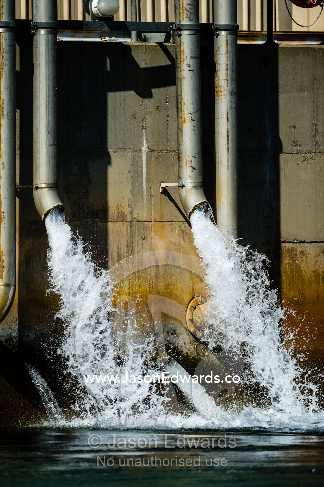 Water pours from the outlet station of the Ord River hydro power plant. Ord River Dam, Lake Argyle, Kimberley Coast, Western Australia, Australia.