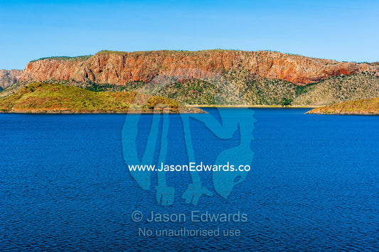 The enormous freshwater Lake Argyle surrounded by desert mountains. Ord River Dam, Lake Argyle, Kimberley Coast, Western Australia, Australia.