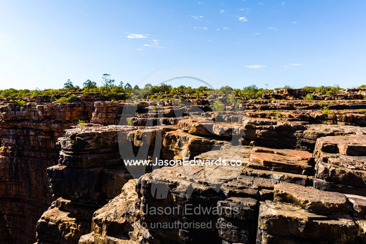 Erosion on a sandstone plateau from wet season flooding. King George River, King George Falls, Gardner Plateau, Kimberley Coast, Western Australia, Australia.