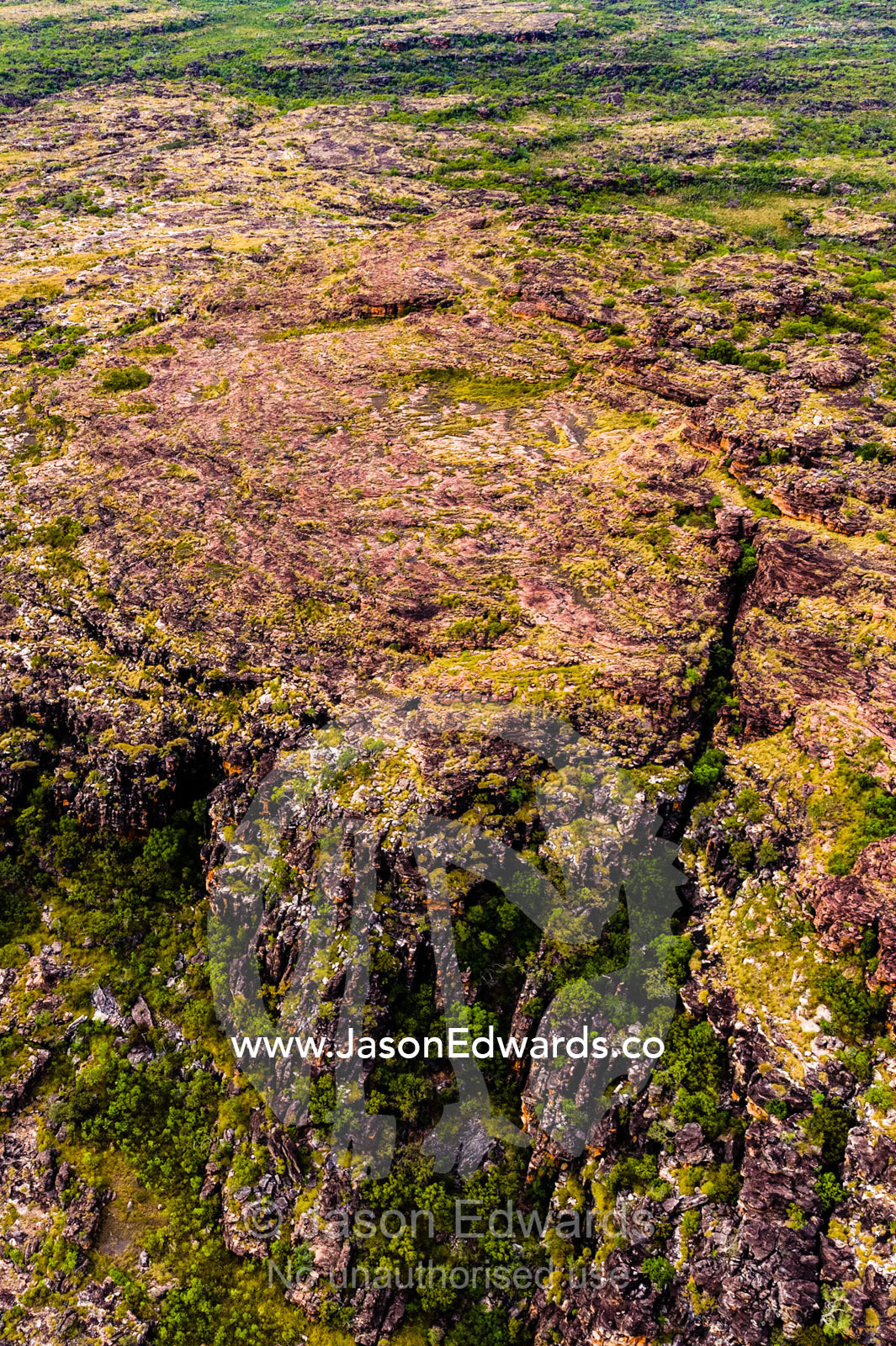 An aerial view of the harsh rocky surface of an arid plateau on the Kimberley coastline. Mitchell River National Park, Mitchell Plateau, Kimberley Coast, Western Australia, Australia.