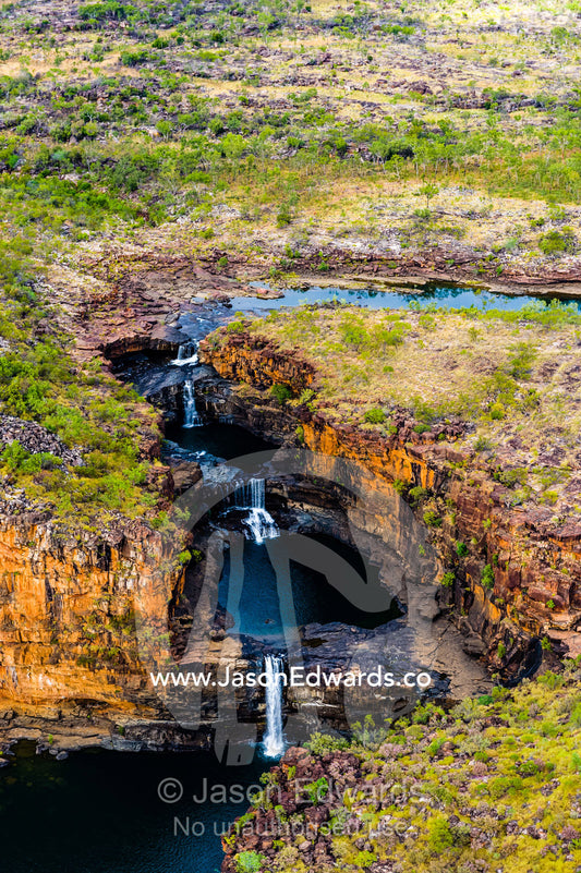 The Mitchell River winds it's way over a plateau before cascading in waterfalls. Mitchell Falls, Mitchell River National Park, Mitchell Plateau, Kimberley Coast, Western Australia, Australia.