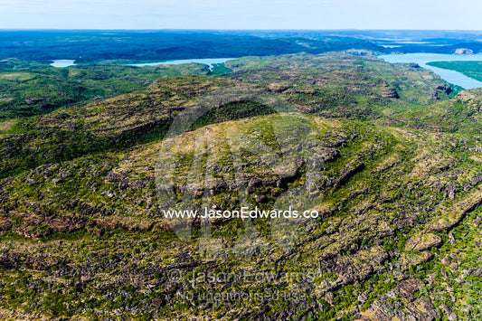 An aerial view of the harsh rocky surface of an arid plateau on the Kimberley coastline. Mitchell River National Park, Mitchell Plateau, Kimberley Coast, Western Australia, Australia.