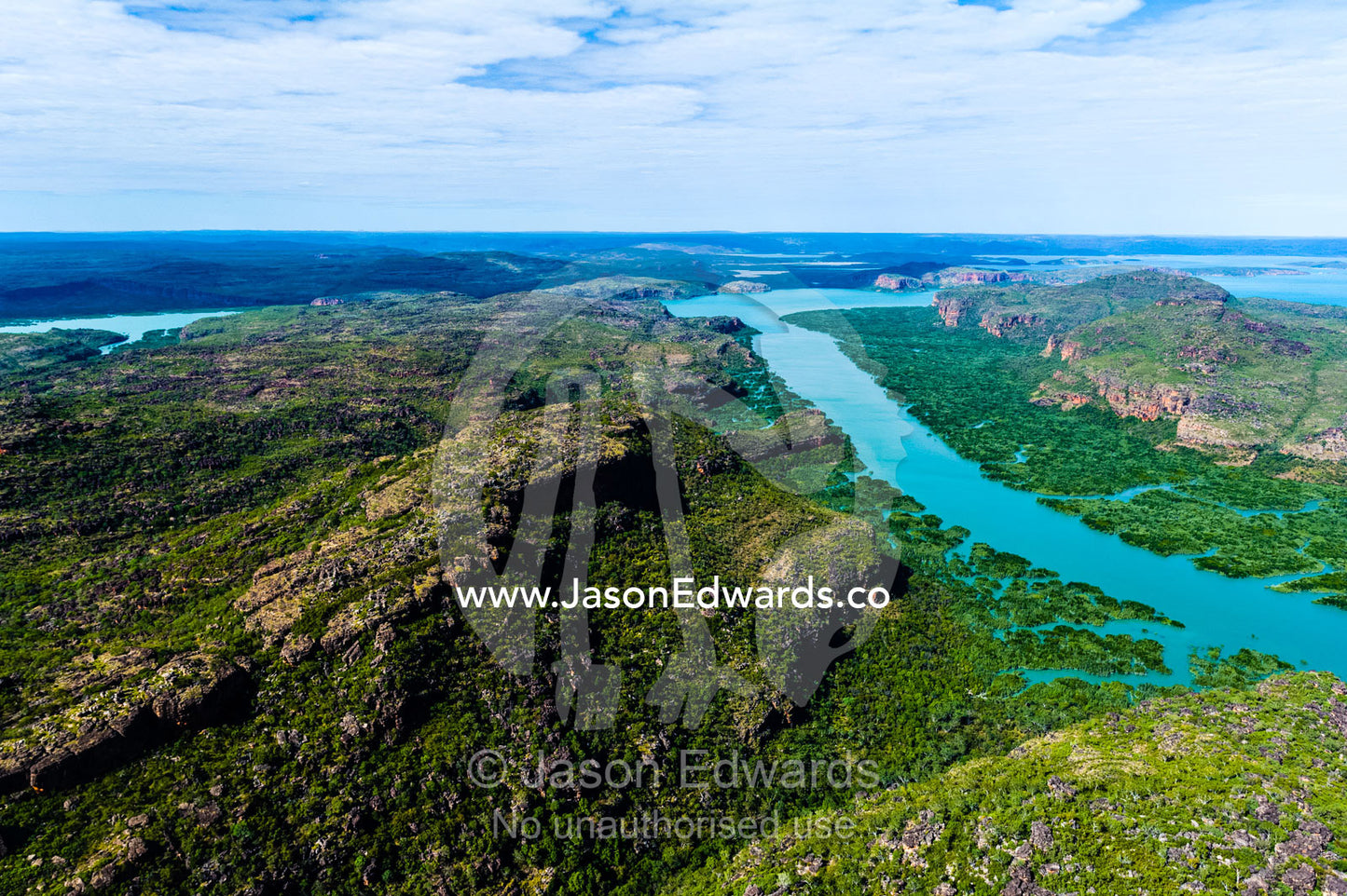 An aerial view of river tidal inlets winding their way through mangrove forests. Porosus Creek, Hunter River, Mitchell River National Park, Mitchell Plateau, Kimberley Coast, Western Australia, Australia.