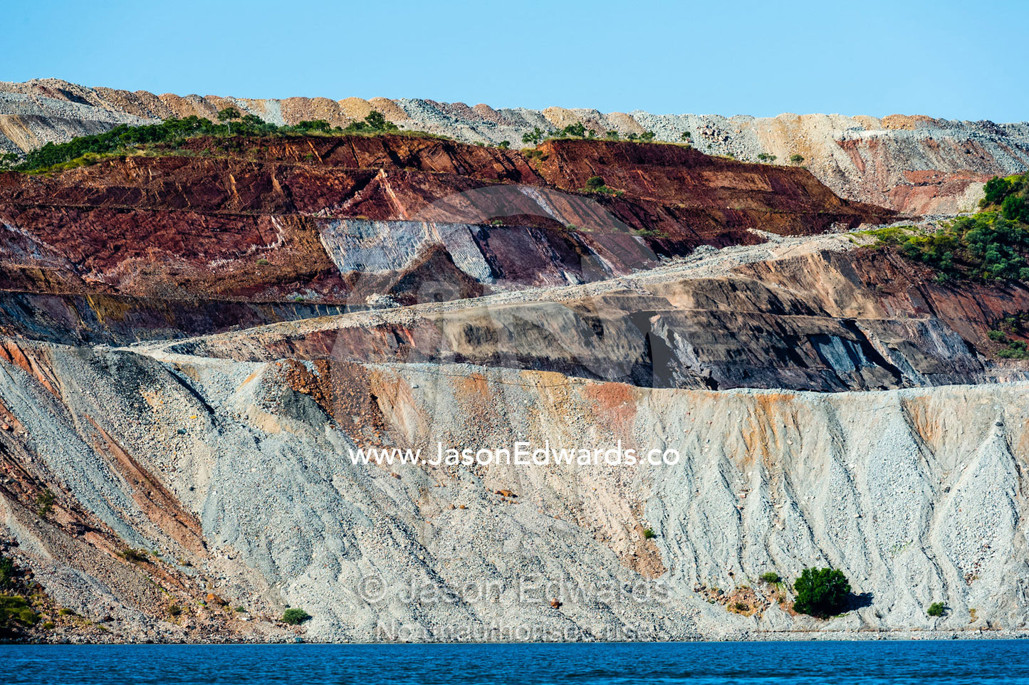 The slag heaps of an iron ore mine working on an island. Cockatoo Island, Yampi Sound, Buccaneer Archipelago, Kimberley Coast, Western Australia, Australia.