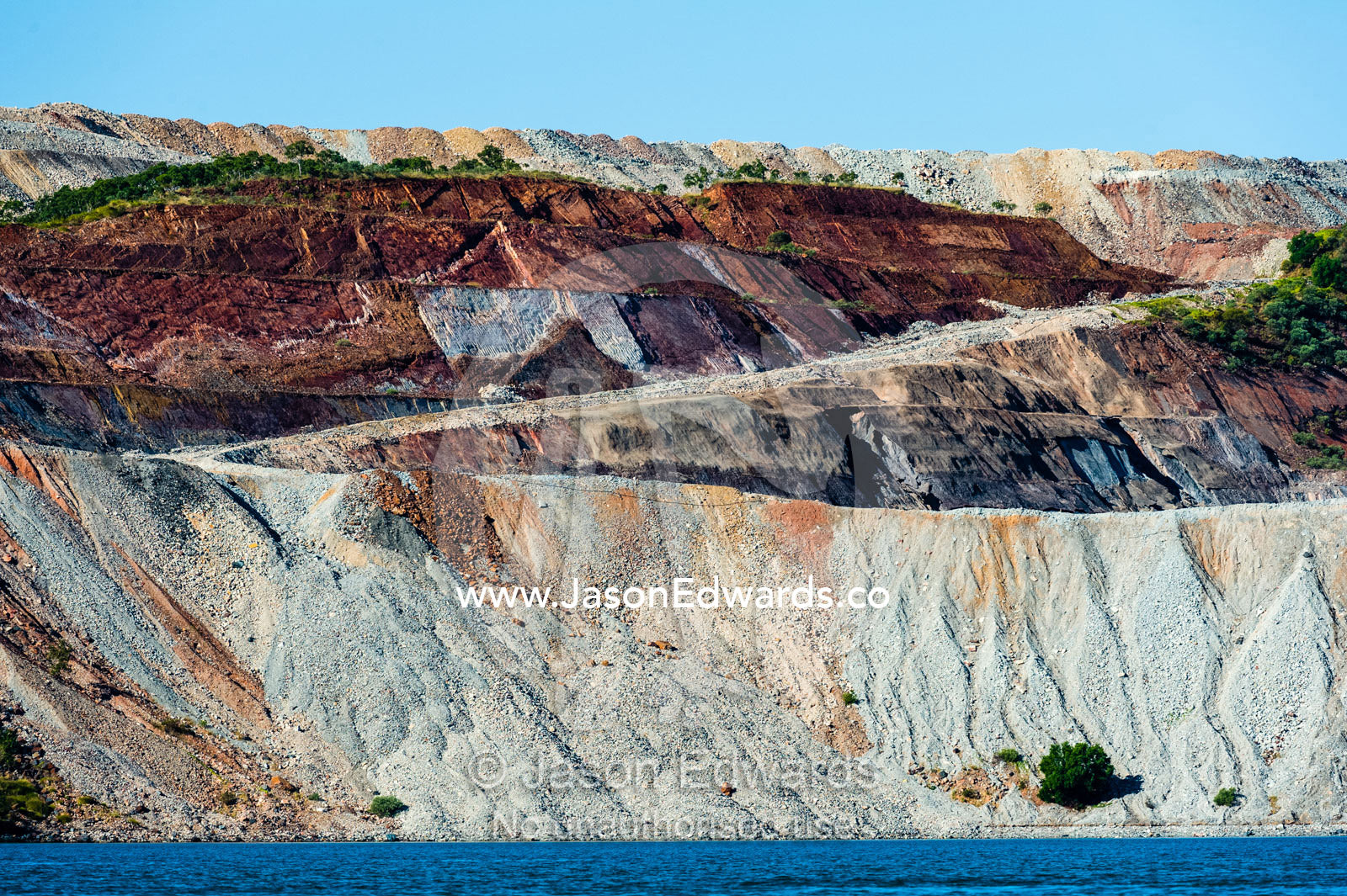 The slag heaps of an iron ore mine working on an island. Cockatoo Island, Yampi Sound, Buccaneer Archipelago, Kimberley Coast, Western Australia, Australia.