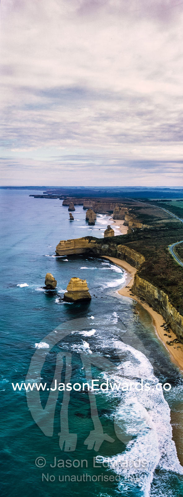 An aerial view of the sheer limestone cliffs and the Twelve Apostles pillars. Twelve Apostles, Port Campbell National, Great Ocean Road, Victoria, Australia.