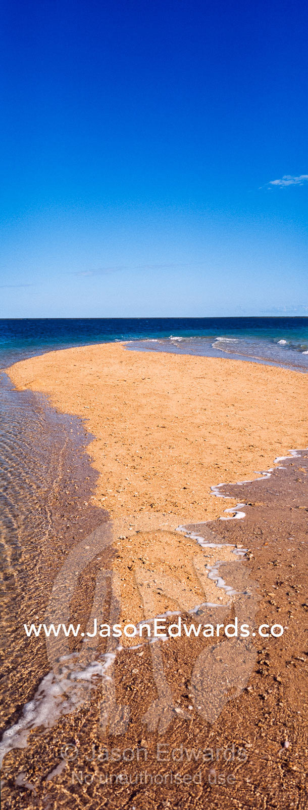 The rising tide swallows a small sand island. Montgomery Reef, Camden Sound, Kimberley Coast, Western Australia, Australia.