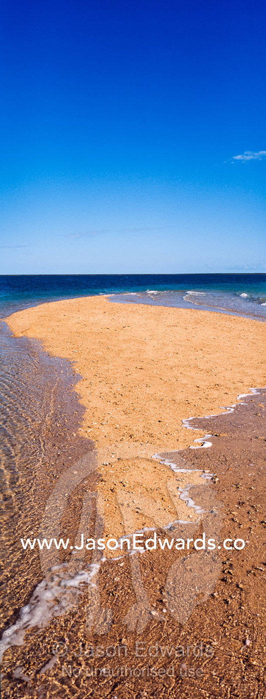 The rising tide swallows a small sand island. Montgomery Reef, Camden Sound, Kimberley Coast, Western Australia, Australia.