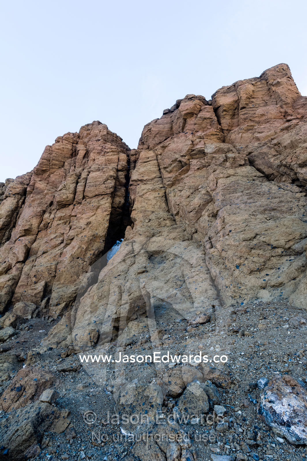 The barren rock wall of a mountain crag in Antarctica. Castle Rock, Ross Island, Antarctica.