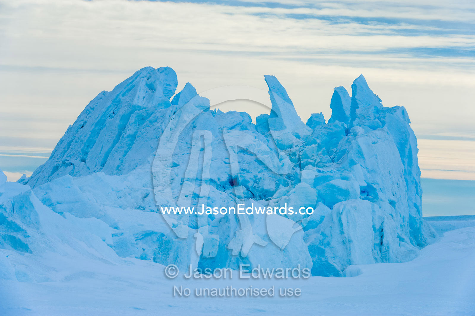 Fractured ice blocks pushed skywards along pressure ridges in the sea ice. Turtle Rock, Erebus Bay, McMurdo Sound, Ross Island, Antarctica.