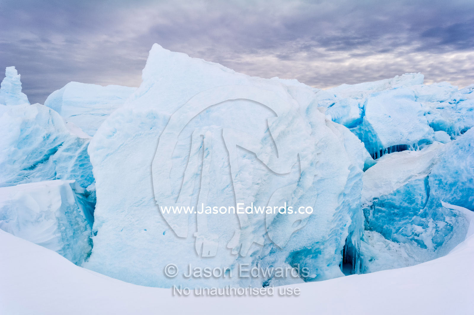 Fractured ice blocks pushed skywards along pressure ridges in the sea ice. Turtle Rock, Erebus Bay, McMurdo Sound, Ross Island, Antarctica.
